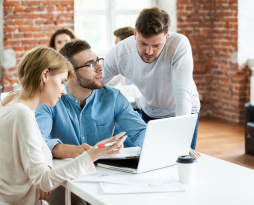 how to request a single case agreement before PHP admission - behavioral health billing and admissions team reviewing payer contract terms in an office meeting